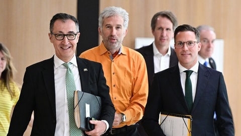 Von links: Ministerpräsident Cem Özdemir (Grüne), Boris Palmer (parteilos) und Innenminister Manuel Hagel. Seit 100 Tagen ist die neue Landesregierung im Amt - so schlägt sie sich bislang.