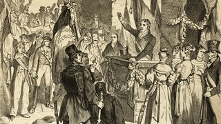 Das Hambacher Fest (Mai 1832) in einer historischen Ullustration von 1882: Volksversammlung im Freien, Redner, Zuhörer, Bevölkerung, Fahnen. – Wenn sich Deutsche von patriotischen Gefühlen leiten ließen, ist das meistens schiefgegangen. 