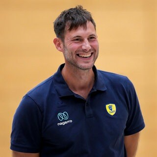 Uwe Gensheimer (Sportlicher Leiter, RNL) lacht in die Kamera.