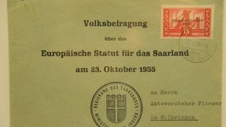 Briefumschlag. Aufschrift: Volksbefragung über das Europäische Statut für das Saarland am 23. Oktober 1955