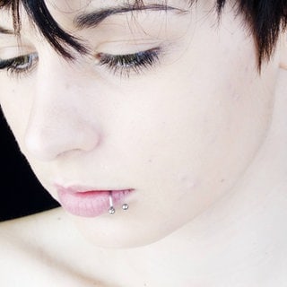 Lippenpiercing. Symbolfoto.