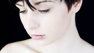 Lippenpiercing. Symbolfoto.