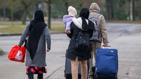 Migranten mit Reisegpäck