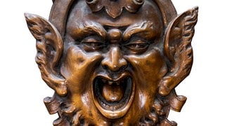 Teufelsfratze aus Holz mit geschlitzten Ohren: Woher kommt der Ausdruck "Schlitzohr"?