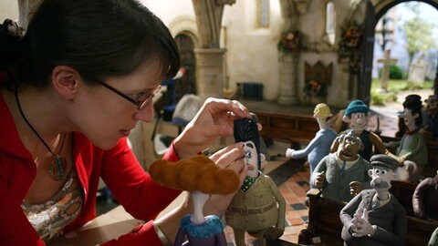 Filmszene Knetfiguren Wallace und Gromit bei Verfolgungsjagd
