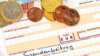 Überweisungsschein mit der Aufschrift Spendenbeitrag.