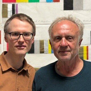 Der Maler und Autor Werner Schmidt (rechts) und einer seiner Projektpartner und Co-Autoren Dr. Jakob Brüssermann.
