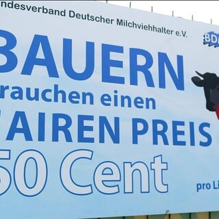 Plakat mit der Aufschrift Bauern brauchen einen fairen Preis