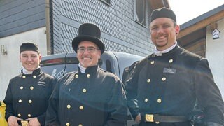 Das Unternehmen Schornsteinfeger Heinrich, von links nach rechts: Emil Dickel, Marcel Heinrich, Sven Reschke
