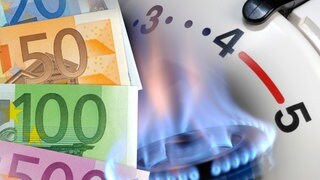 Geldscheine und eine Gasflamme