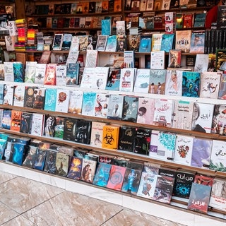 UAE, Dubai, Sale of books at the fair in Arabic language in the Global Village pavilion