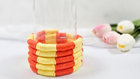 Vasen-Upcycling aus bunten Garnresten