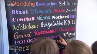 Kinder lernen Wörter im Dialekt